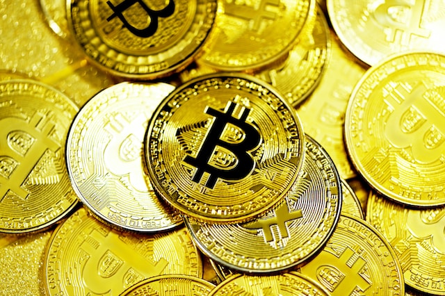 Gold Bitcoins scattered on a flat surface